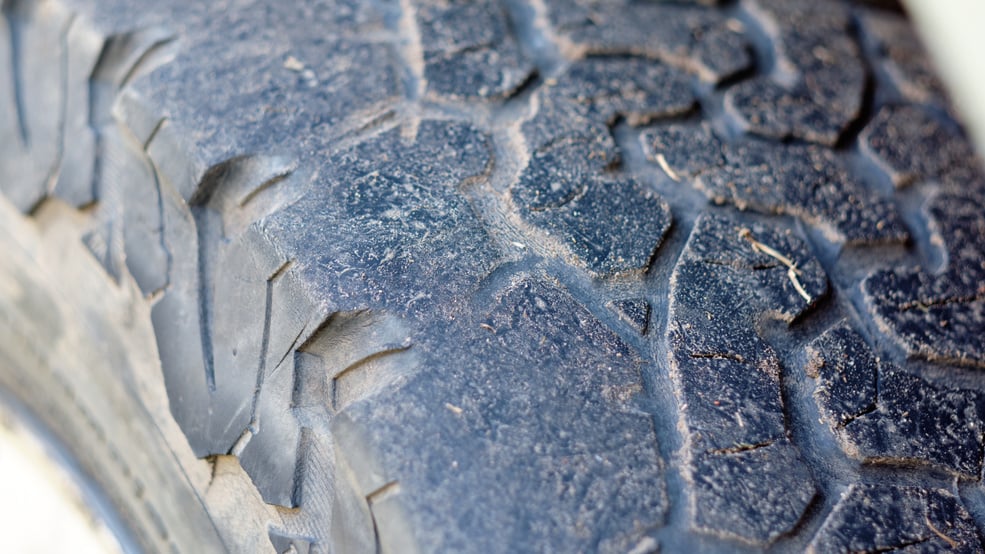 A tire with a small tread depth. The concept of road safety